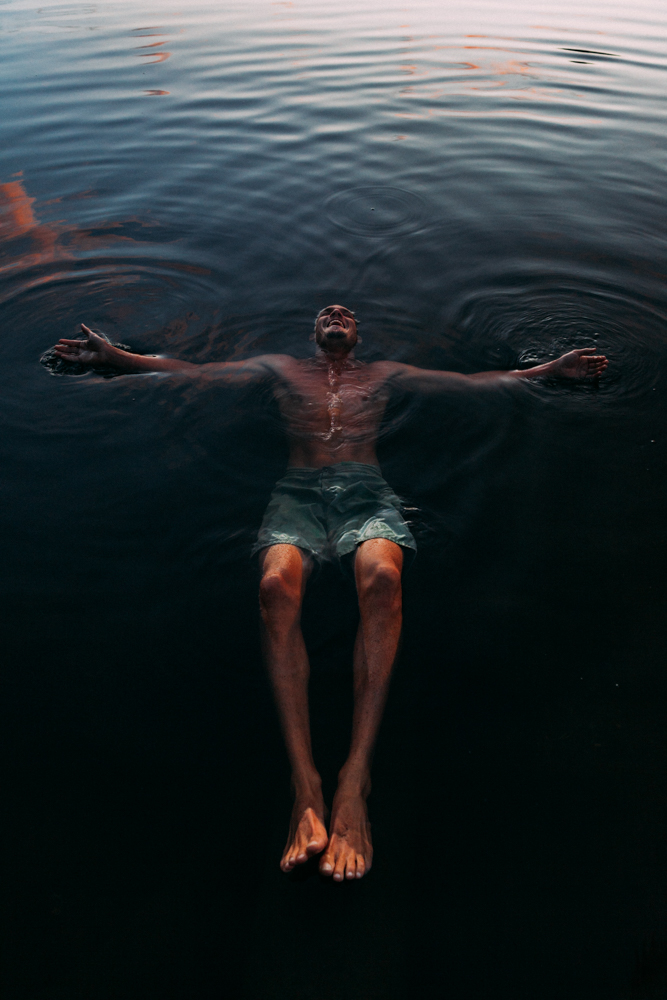 man floating in water