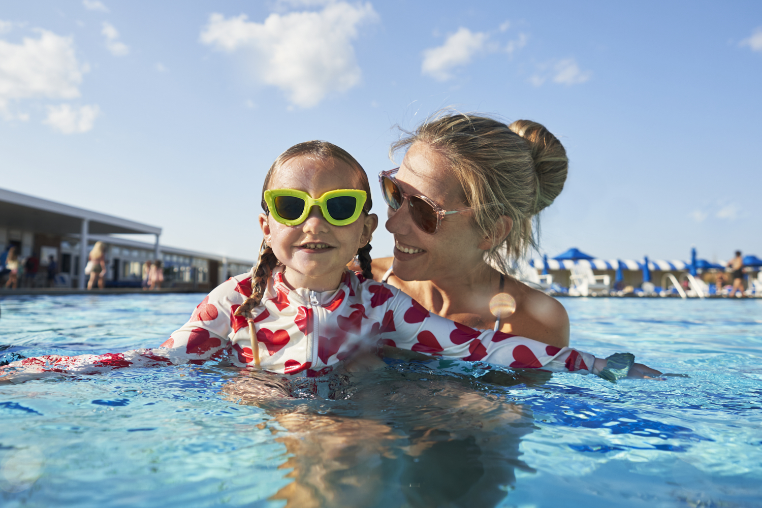 woman and daughter in pool